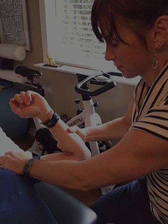 Maggie Phillips-Scarlett working with patient in Squamish